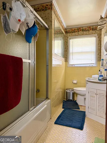 a bathroom with a sink a mirror and a bathtub