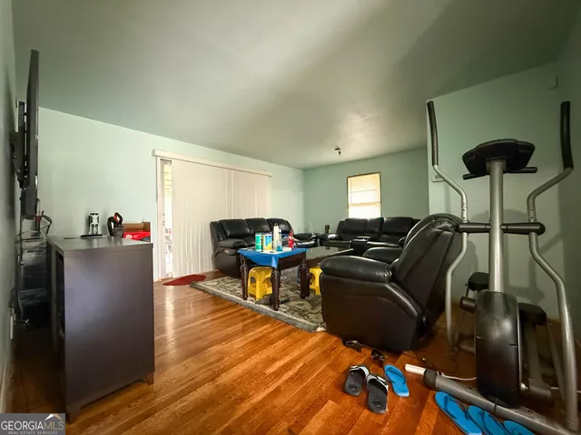 a living room with furniture a chandelier