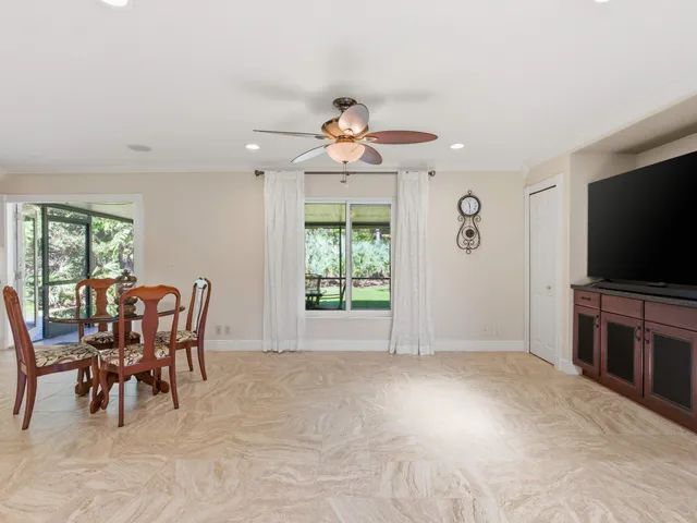 a living room with a flat screen tv and a fireplace