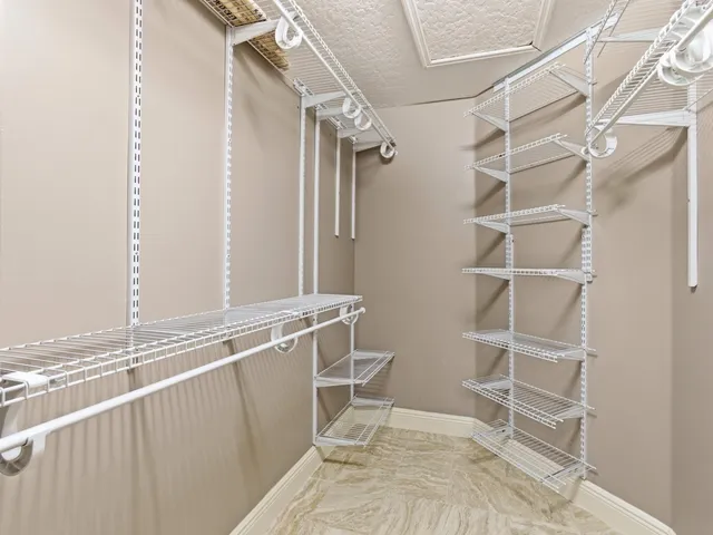 a bathroom with a granite countertop sink a toilet and bathtub