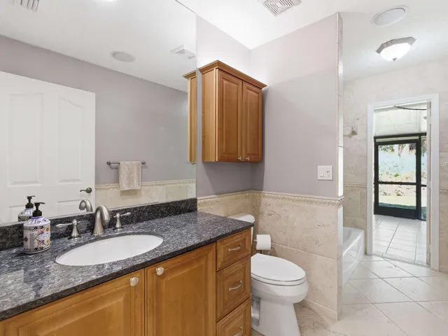 a utility room with sink dryer and washer