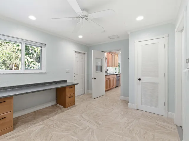 a view of a porch with chairs and backyard