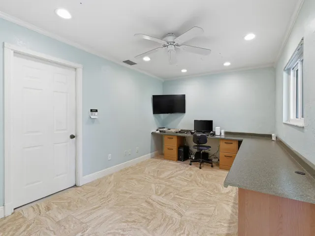 a view of a livingroom with furniture and lounge chair