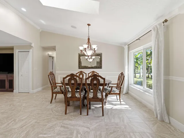 a view of a dining room with furniture window and outside view