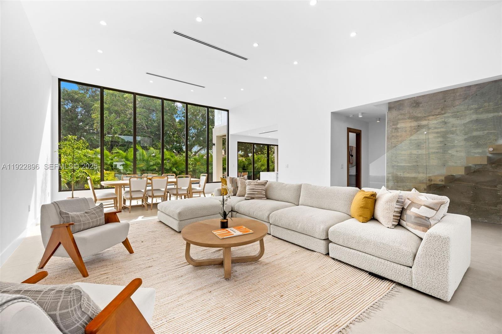 66 Northwest 50th Street Miami, FL 33127 - Photo 11 of 60 a living room with furniture and a large window