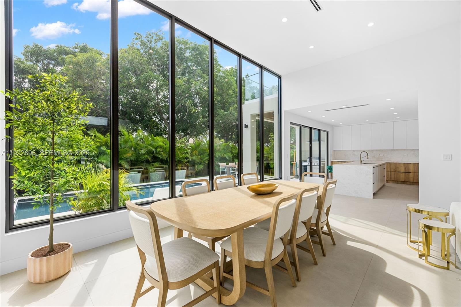 66 Northwest 50th Street Miami, FL 33127 - Photo 16 of 60 a view of a dining room with furniture window and outside view