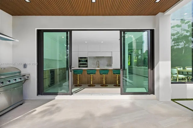 a view of a big room with wooden floor and windows