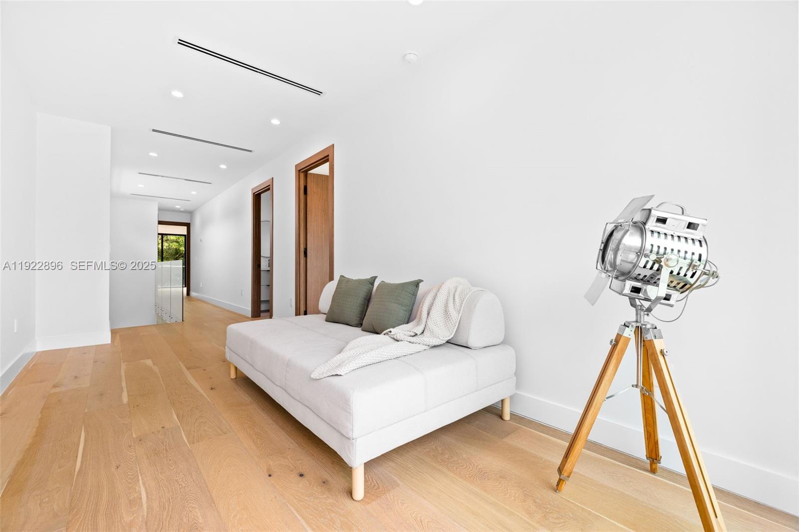 66 Northwest 50th Street Miami, FL 33127 - Photo 28 of 60 a bedroom with a bed and a wooden floor