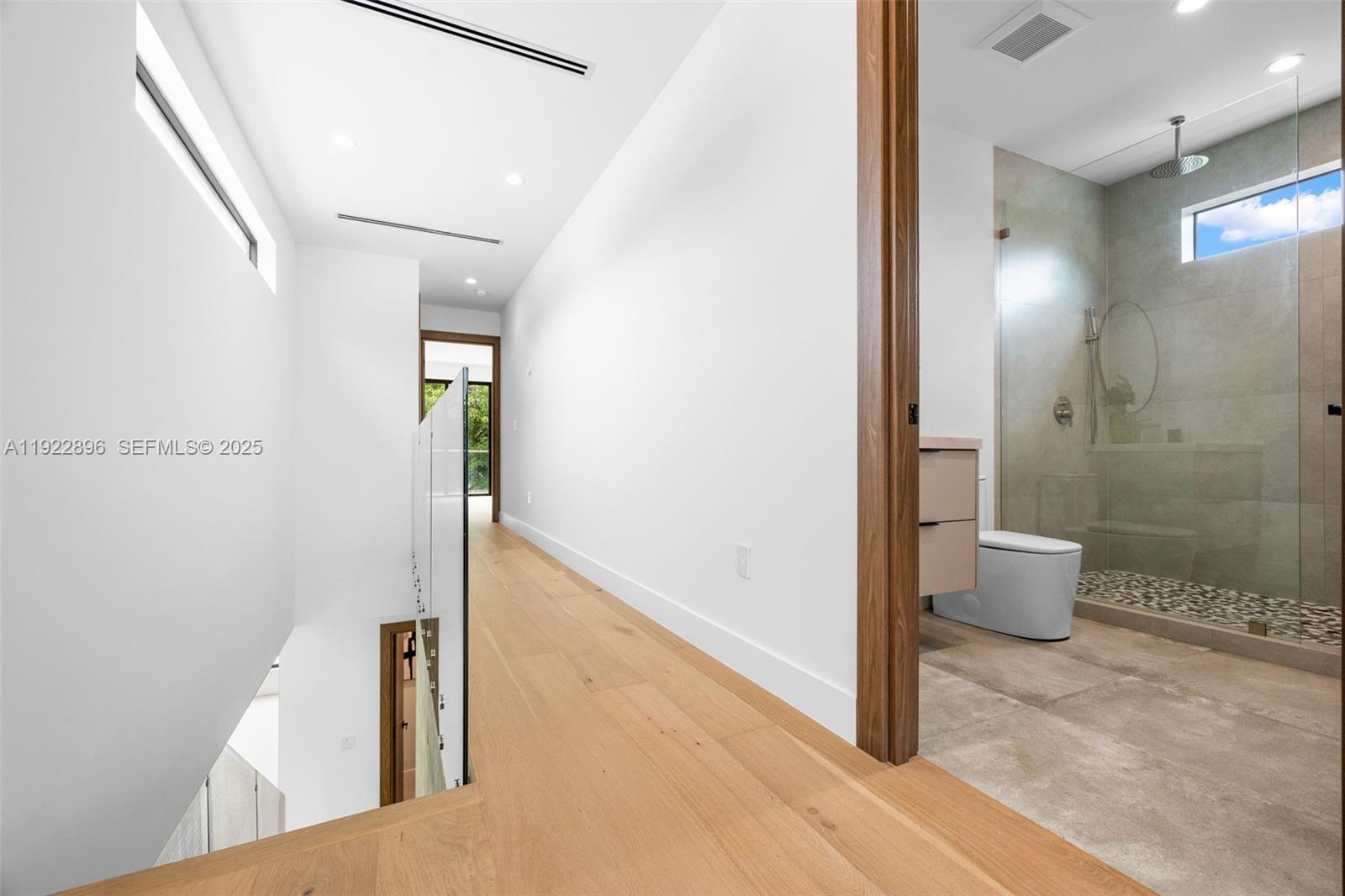 66 Northwest 50th Street Miami, FL 33127 - Photo 31 of 60 a bathroom with a shower and a toilet