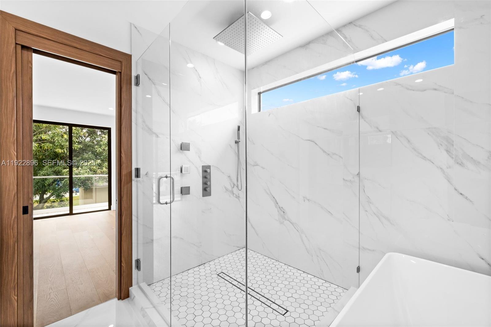 66 Northwest 50th Street Miami, FL 33127 - Photo 38 of 60 a bathroom with a shower and a sink