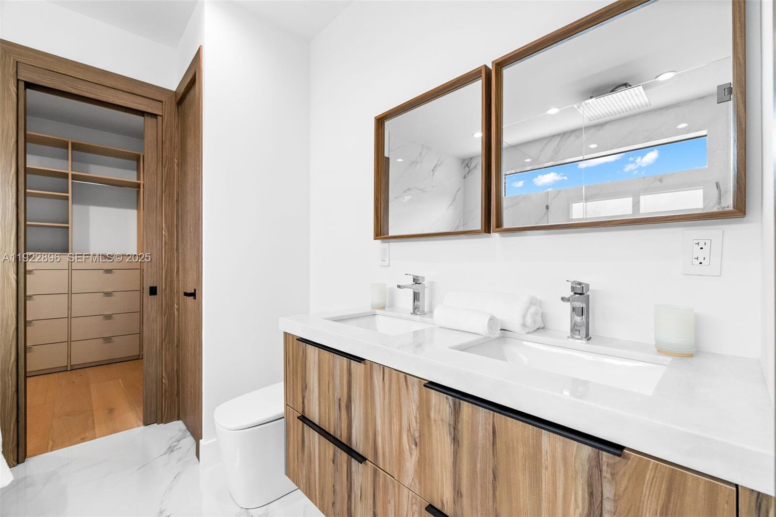 66 Northwest 50th Street Miami, FL 33127 - Photo 39 of 60 a bathroom with a sink a toilet and shower