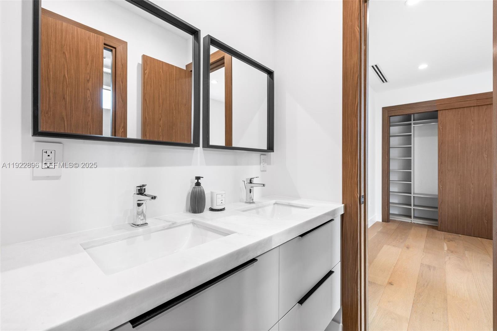 66 Northwest 50th Street Miami, FL 33127 - Photo 43 of 60 a bathroom with a sink and a mirror