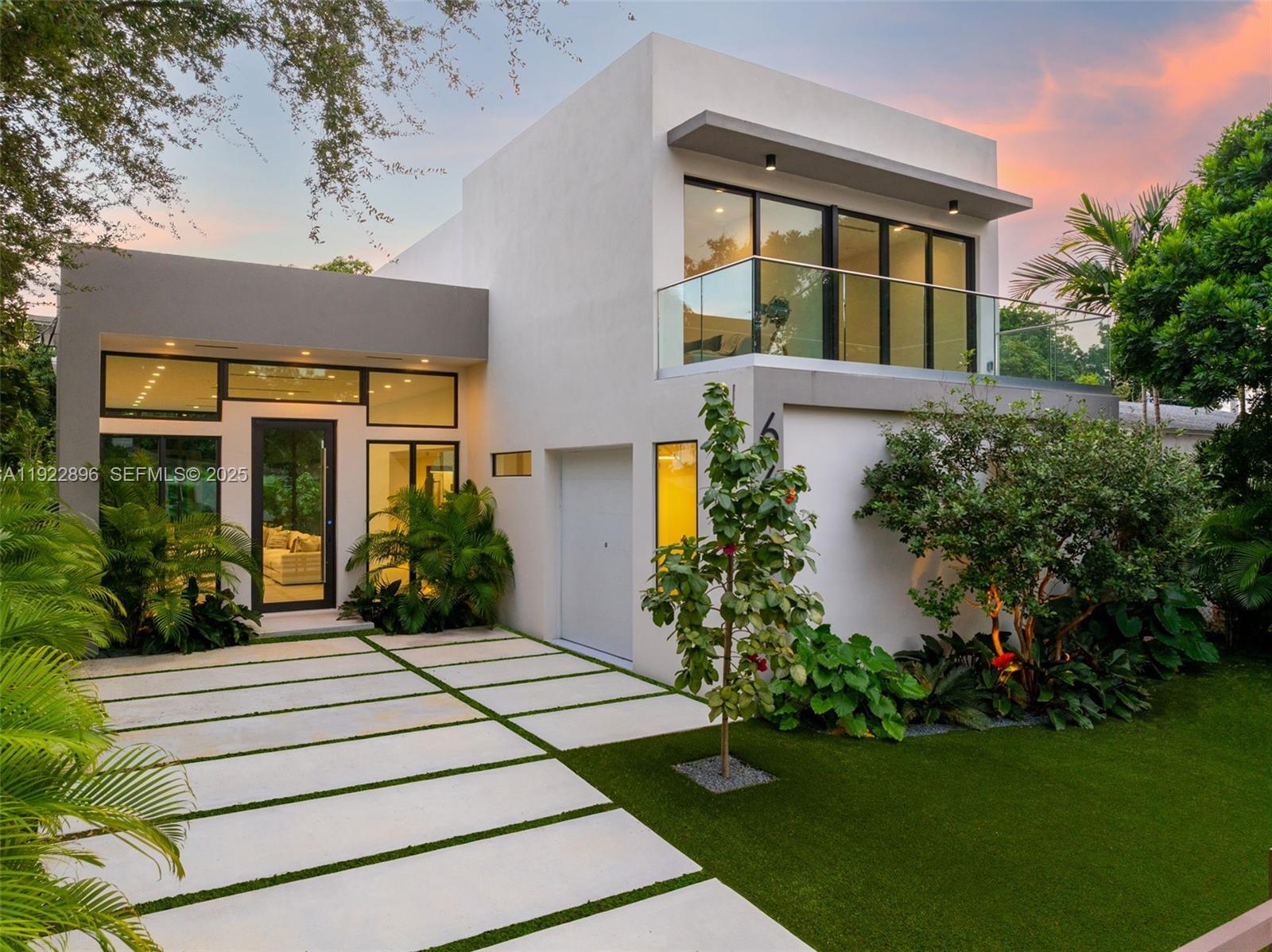 66 Northwest 50th Street Miami, FL 33127 - Photo 56 of 60 a front view of a house with a yard