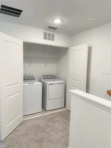 a room with a stove and a refrigerator