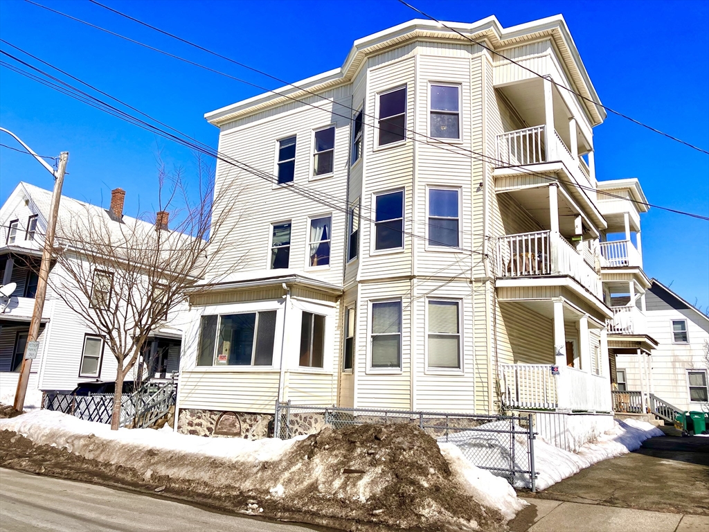 41 Brimblecom Street, Unit 3 Lynn, MA 01902 - Photo 1 of 16 a front view of a large white building