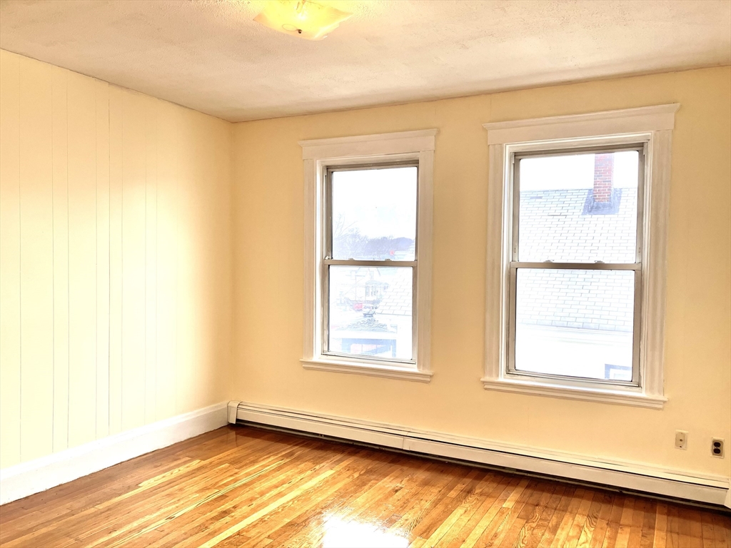41 Brimblecom Street, Unit 3 Lynn, MA 01902 - Photo 14 of 16 a view of an empty room with a window
