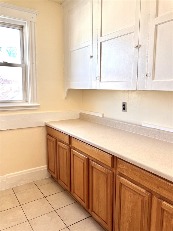 41 Brimblecom Street, Unit 3 Lynn, MA 01902 - Photo 9 of 16 a kitchen with stainless steel appliances granite countertop a sink and a white cabinets