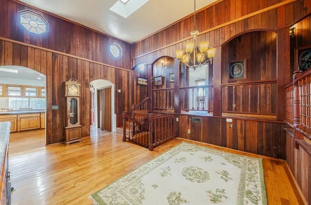 a view of an entryway with wooden floor