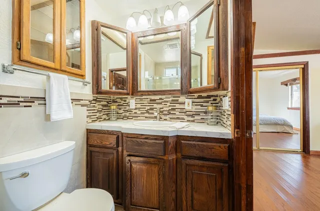 a bathroom with a glass shower door