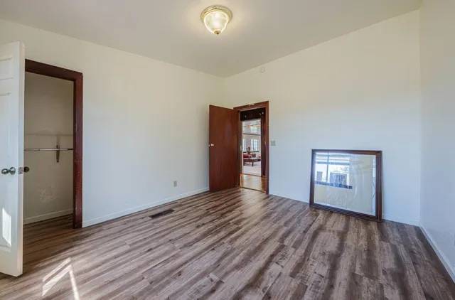 a view of a livingroom with furniture and a window