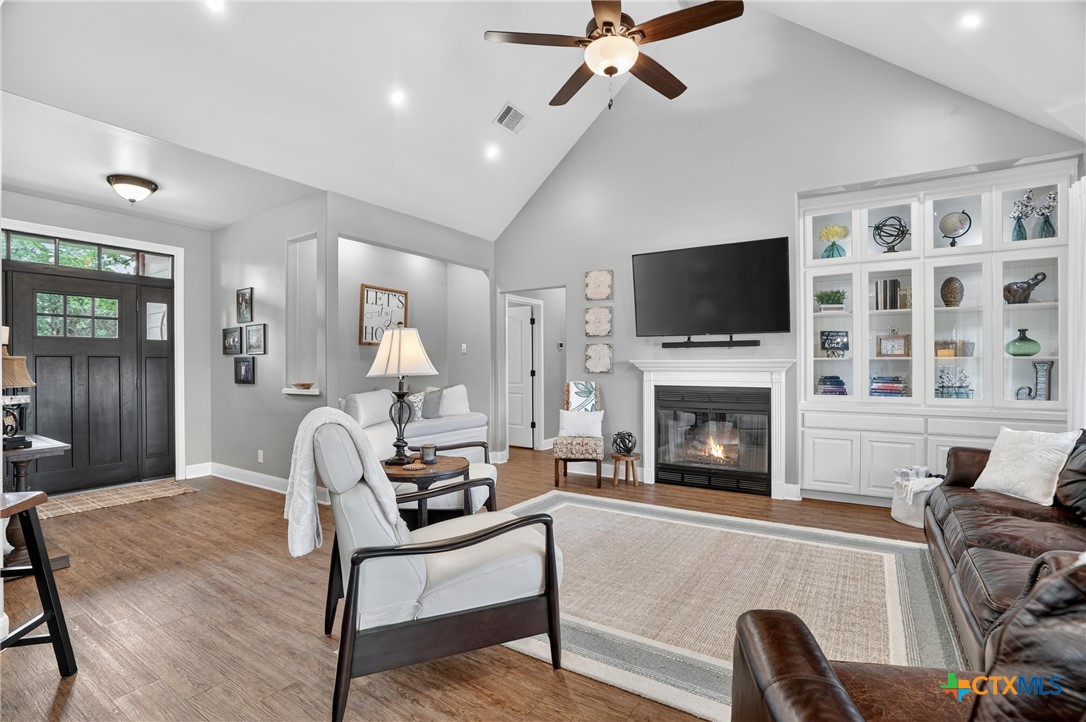 1899 Sunflower Trail Luling, TX 78648 - Photo 6 of 48 Built ins and valued ceiling in the living room.