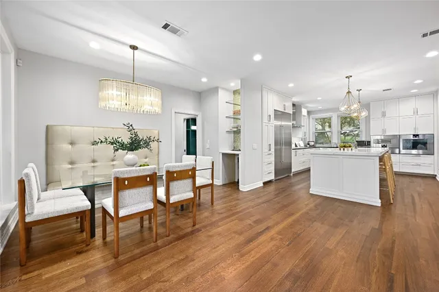 a view of a kitchen and dining room