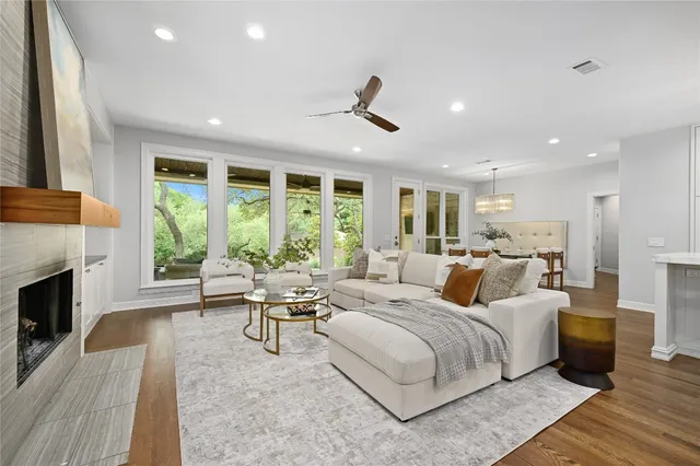 a living room with furniture fireplace and window