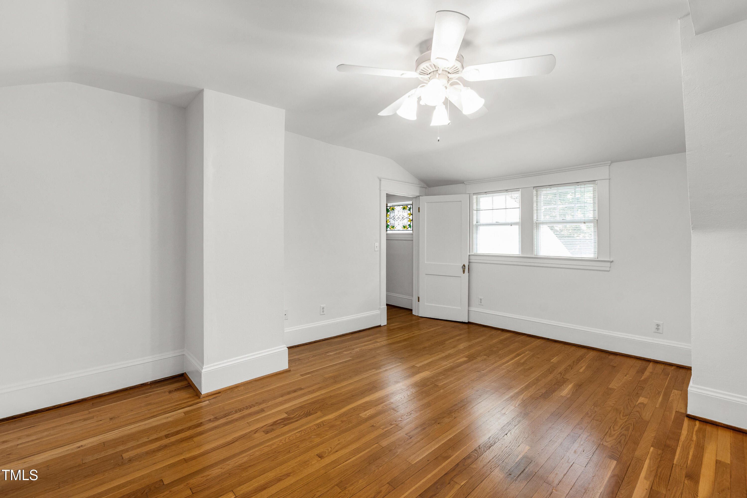 2202 St Marys Street Raleigh, NC 27608 - Photo 34 of 63 an empty room with wooden floor and windows