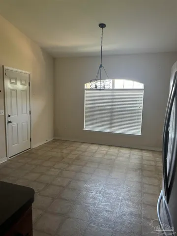 a view of empty room with windows