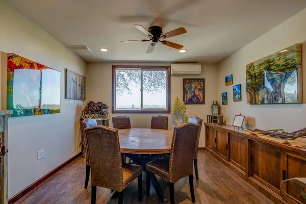 a view of a dining room with furniture window and wooden floor
