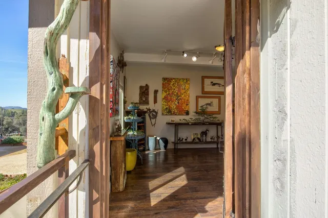 a view of a lake with houses in the back