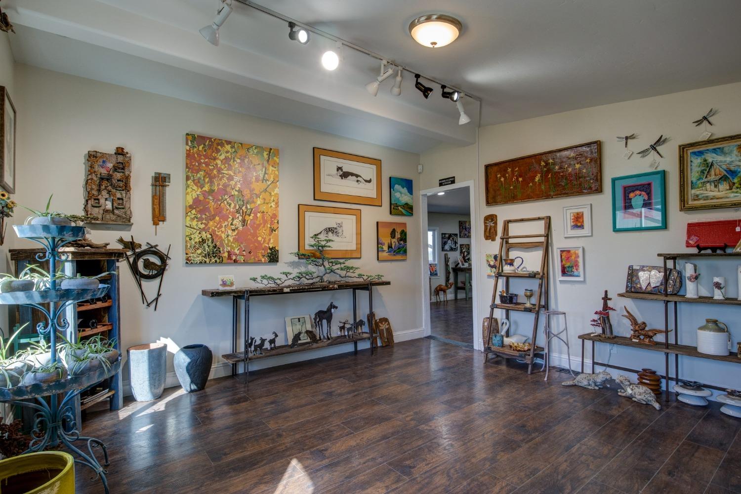 Undisclosed Address Somerset, CA 95684 - Photo 26 of 90 a living room with furniture and a wooden floor
