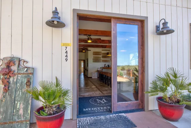 a view of a dining room with furniture and window