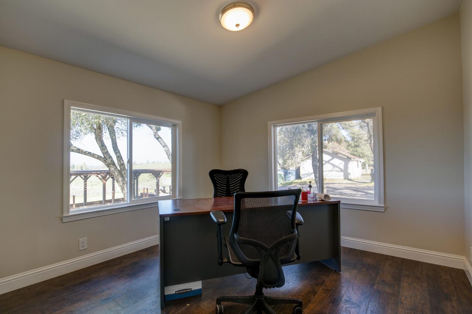 Undisclosed Address Somerset, CA 95684 - Photo 33 of 90 a view of a workspace with furniture and a window