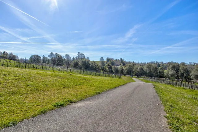 a view of a swimming pool with mountains and a mountain in the background