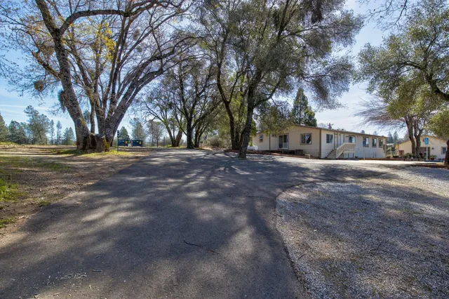 a view of a swimming pool with mountains in the background