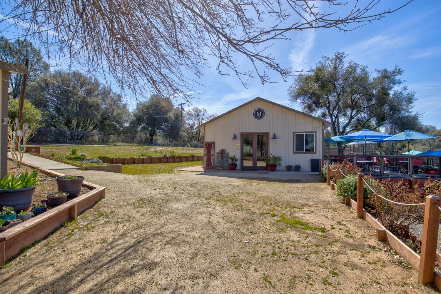 Undisclosed Address Somerset, CA 95684 - Photo 50 of 90 a view of a house with backyard and sitting area