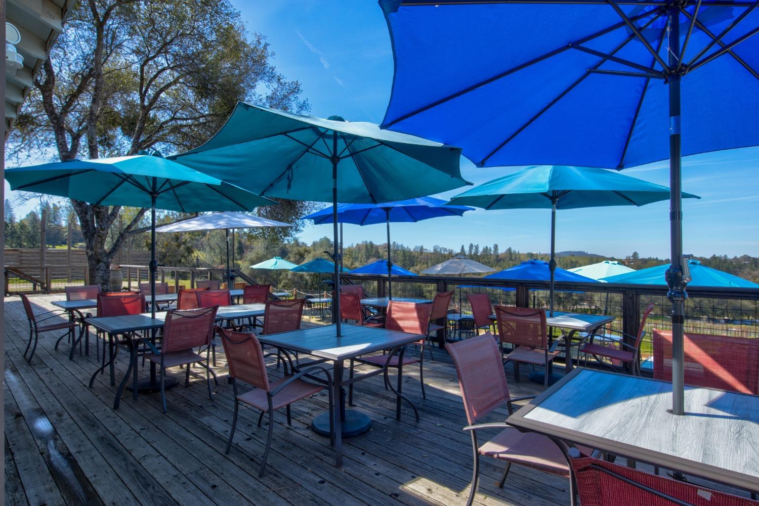 Undisclosed Address Somerset, CA 95684 - Photo 52 of 90 an outdoor space with tables and chairs