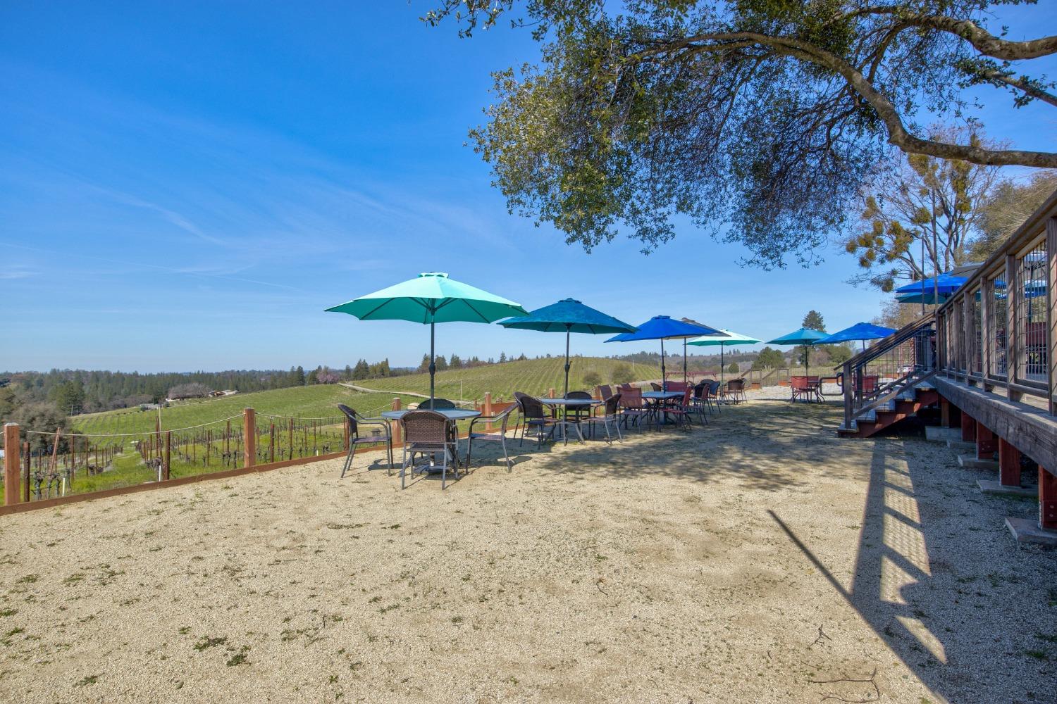 Undisclosed Address Somerset, CA 95684 - Photo 58 of 90 a view of a lake with a table under an umbrella