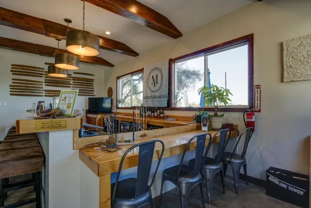 a kitchen with lots of counter space and breakfast area