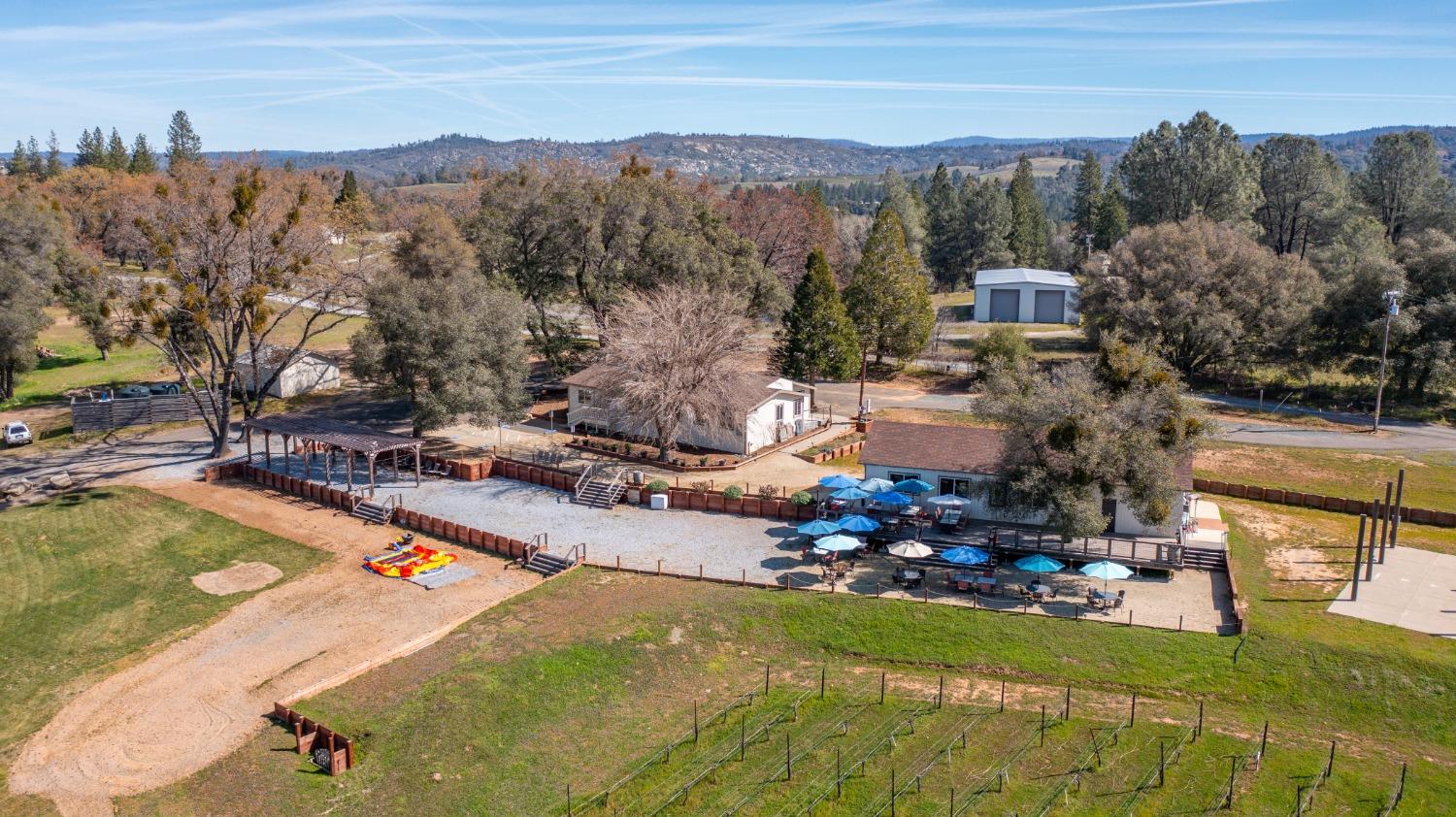 Undisclosed Address Somerset, CA 95684 - Photo 82 of 90 a view of a swimming pool with a yard and mountain view