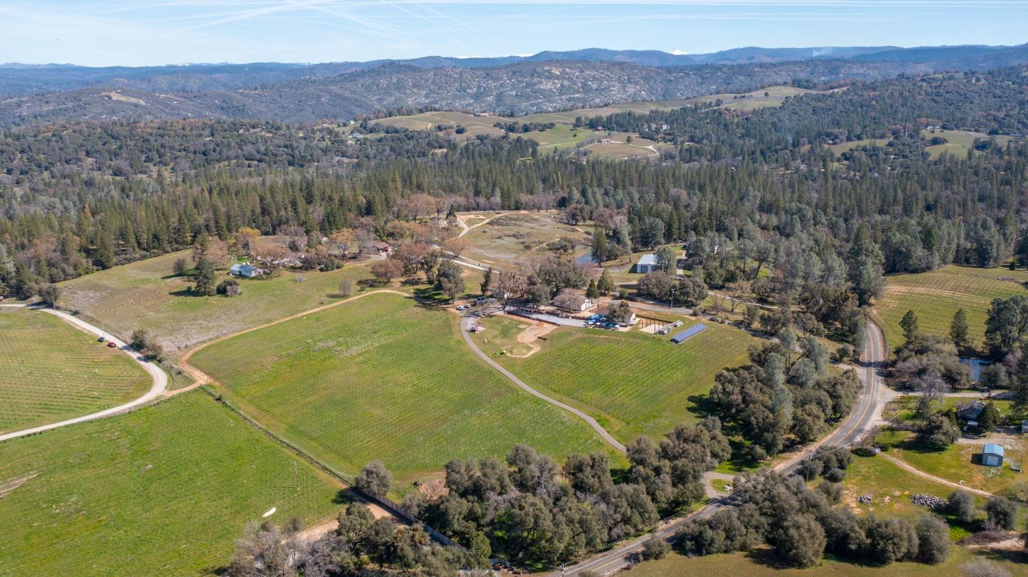 Undisclosed Address Somerset, CA 95684 - Photo 90 of 90 a view of a town with mountains in the background