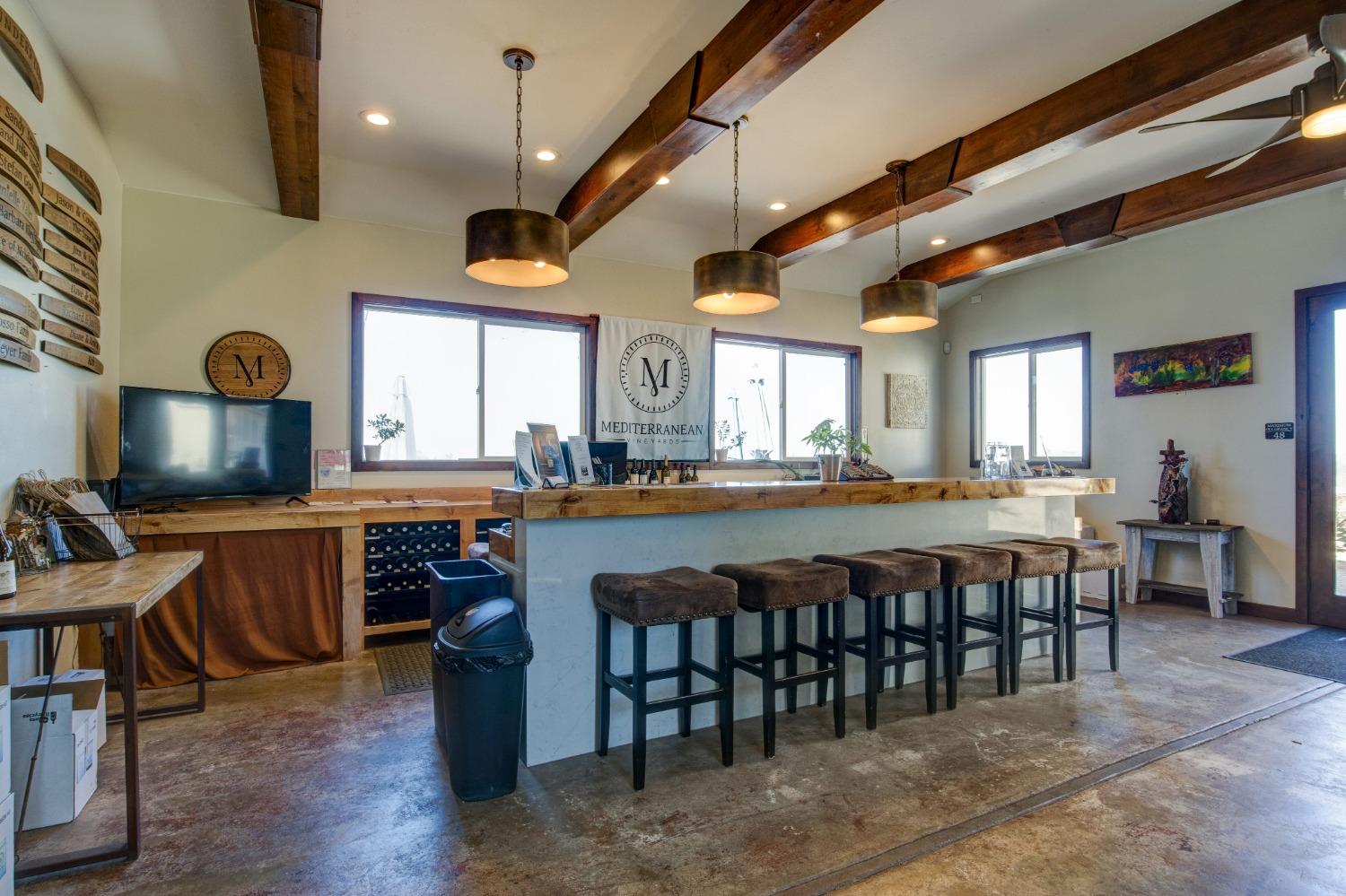 Undisclosed Address Somerset, CA 95684 - Photo 10 of 90 a large dining space with furniture a rug and chandelier