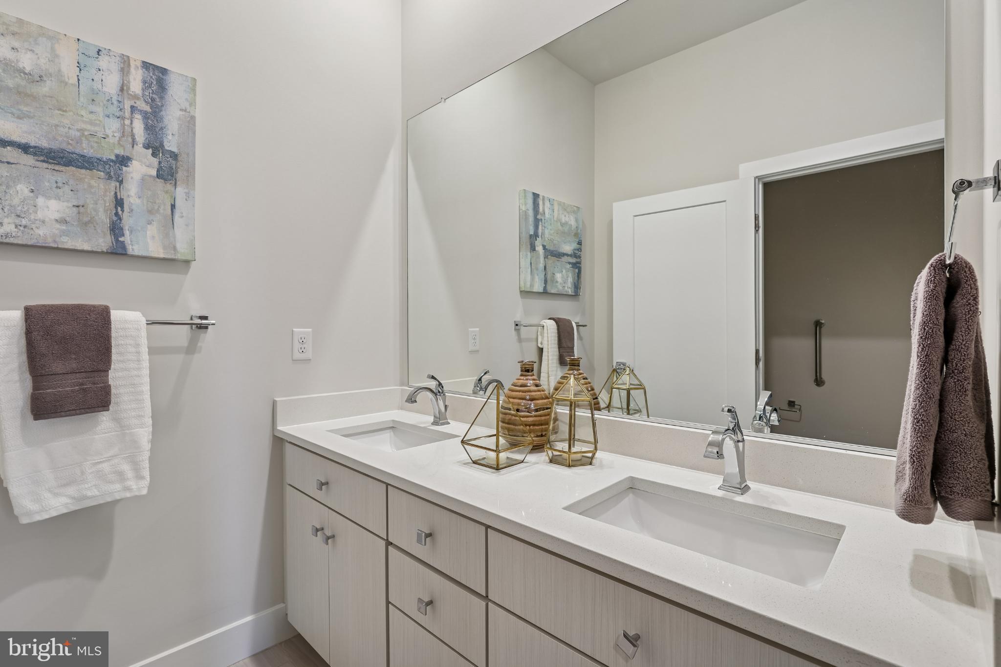 1761 Old Meadow Road, Unit 517 McLean, VA 22102 - Photo 15 of 39 a bathroom with double sink and a mirror