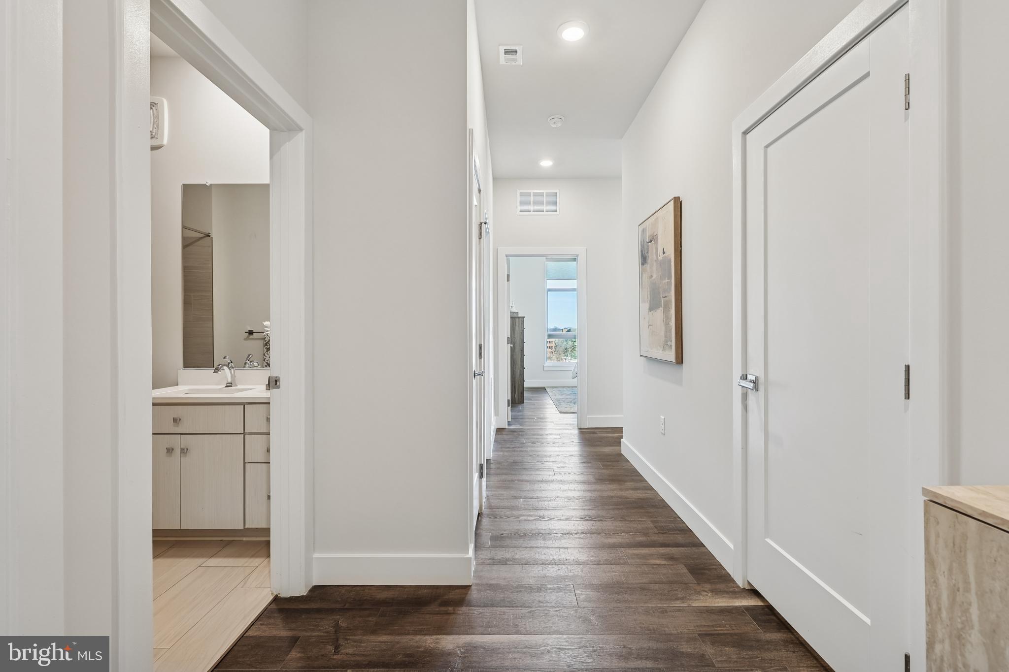 1761 Old Meadow Road, Unit 517 McLean, VA 22102 - Photo 26 of 39 a view of a hallway with wooden floor