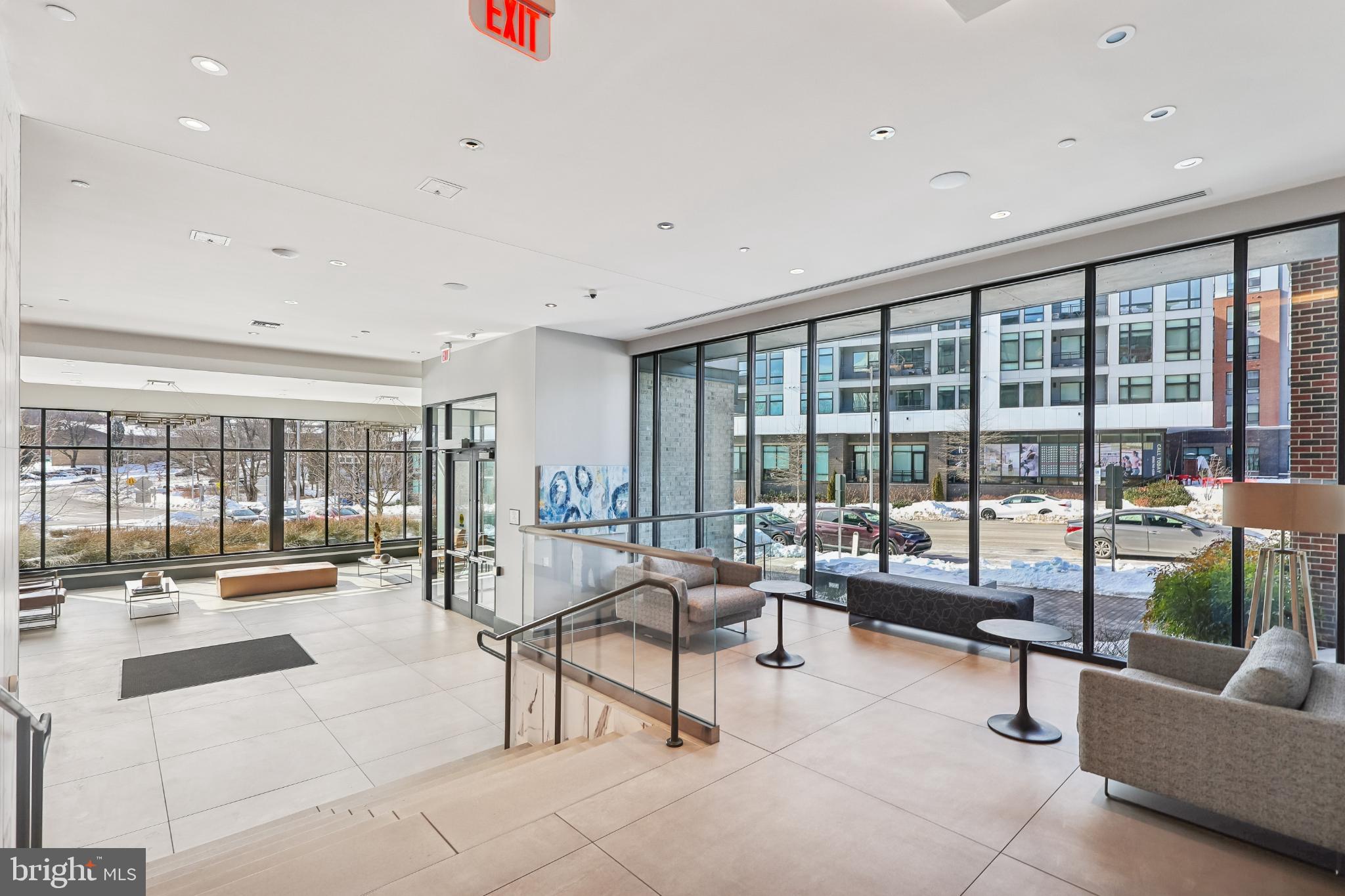 1761 Old Meadow Road, Unit 517 McLean, VA 22102 - Photo 32 of 39 a living room with furniture and a large window