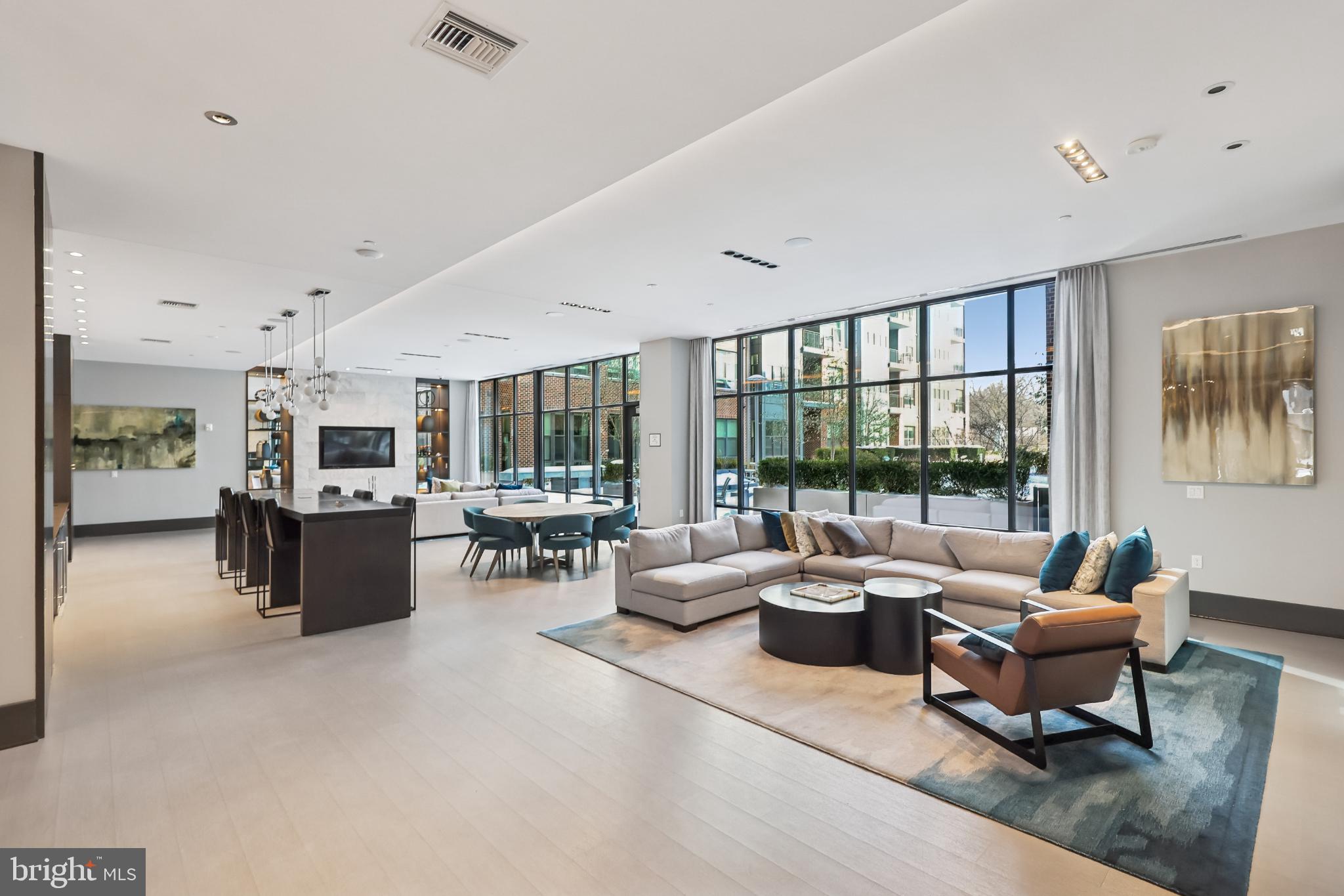 1761 Old Meadow Road, Unit 517 McLean, VA 22102 - Photo 35 of 39 a living room with furniture and a large window