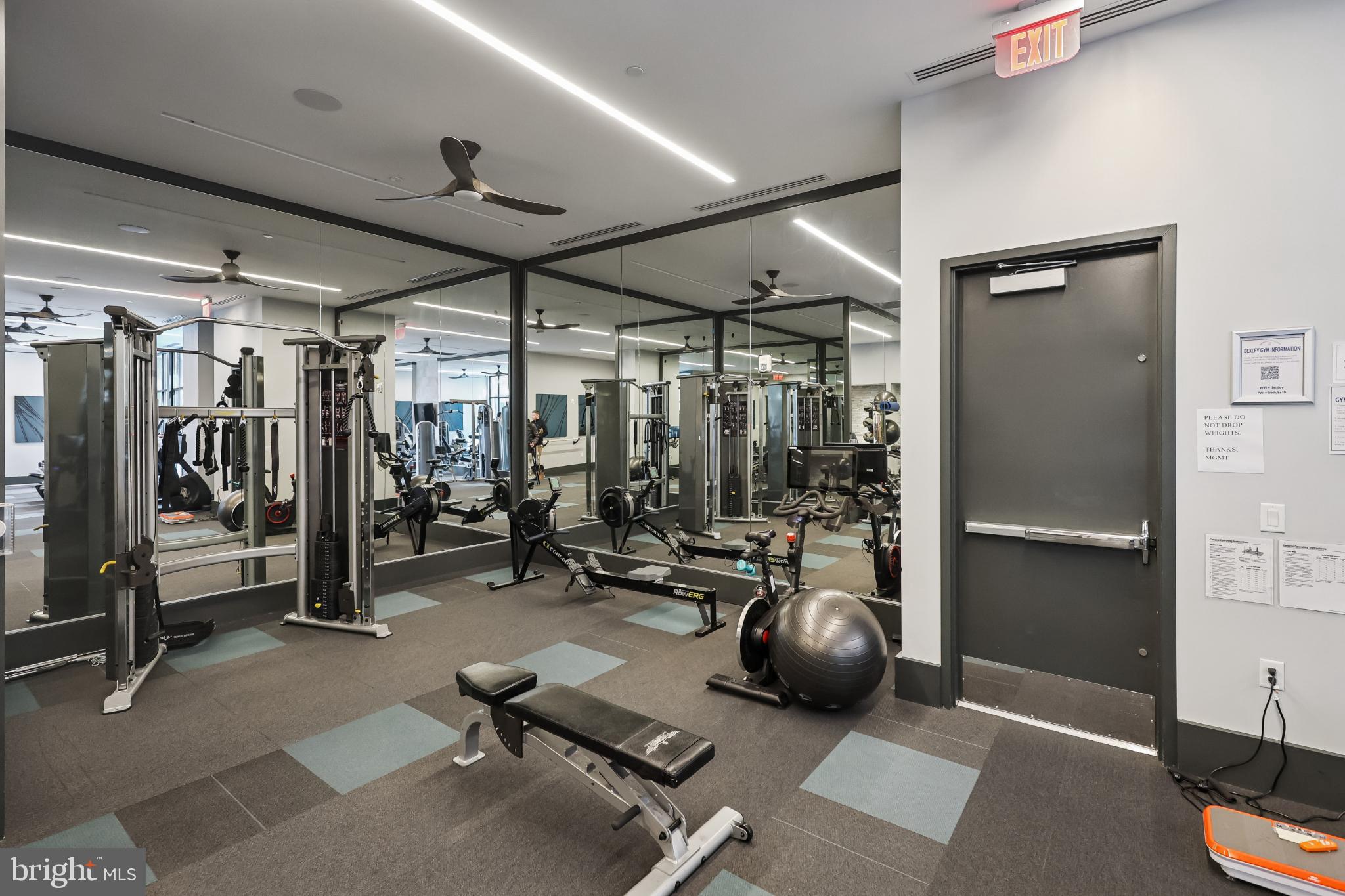 1761 Old Meadow Road, Unit 517 McLean, VA 22102 - Photo 37 of 39 a room with gym equipment and a large window