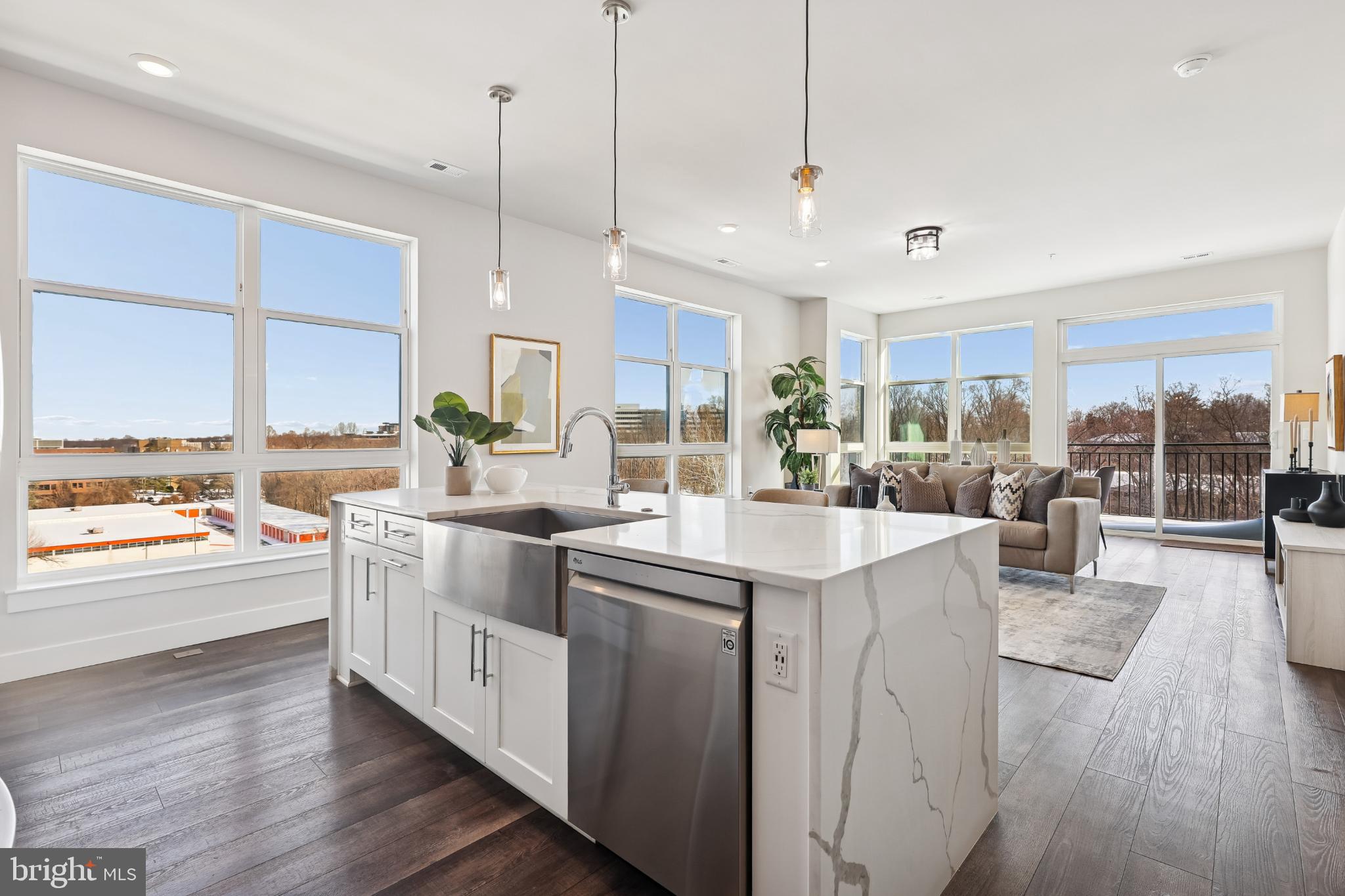 1761 Old Meadow Road, Unit 517 McLean, VA 22102 - Photo 8 of 39 a kitchen with stainless steel appliances granite countertop a stove and a large window