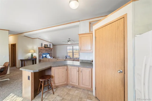 a kitchen with a sink cabinets and window